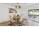 Bright dining area with stylish furnishings and natural light, seamlessly connecting to the outdoor living space at 3803 S Elm St, Tempe, AZ 85282