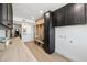 Well-designed laundry room featuring black cabinets, butcher block counters, and a built-in mudroom bench at 3803 S Elm St, Tempe, AZ 85282