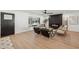 Cozy living room with a modern fireplace, sleek flooring, and ample natural light from a large window at 3803 S Elm St, Tempe, AZ 85282