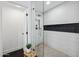 Contemporary bathroom showing glass shower with a stone tiled floor and a white tiled wall at 3803 S Elm St, Tempe, AZ 85282