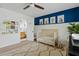 Bedroom with a crib and white wainscoting on the walls at 3922 E Elm St, Phoenix, AZ 85018