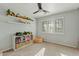 Light-filled bedroom with neutral walls and a large window with plantation shutters at 3922 E Elm St, Phoenix, AZ 85018