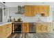 Updated kitchen featuring stainless steel appliances, light countertops and modern wooden cabinetry at 3922 E Elm St, Phoenix, AZ 85018