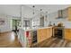 An expansive kitchen island features a wine fridge, lots of storage, and butcher block style end caps at 3922 E Elm St, Phoenix, AZ 85018