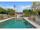 Inviting swimming pool surrounded by comfortable seating and shaded pergolas for outdoor relaxation and enjoyment at 3922 E Elm St, Phoenix, AZ 85018