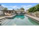 Refreshing swimming pool with lounge chairs, perfect for relaxation and enjoying the outdoors at 3922 E Elm St, Phoenix, AZ 85018