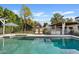 Sparkling swimming pool with lounge chairs, a patio, and lush landscaping, ideal for summer relaxation at 3922 E Elm St, Phoenix, AZ 85018