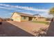 Wide backyard with lots of gravel, a small patio, and a neatly maintained lawn at 4033 S Harlan --, Mesa, AZ 85212