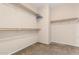 Walk-in closet featuring carpeted floors, and ample shelving for organized storage at 4033 S Harlan --, Mesa, AZ 85212