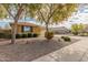 Charming single-story home featuring a well-maintained front yard with desert landscaping at 4033 S Harlan --, Mesa, AZ 85212