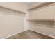 Spacious walk-in closet features carpet floors and shelves, perfect for organizing any wardrobe at 4033 S Harlan --, Mesa, AZ 85212