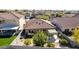 Aerial view of the backyard featuring a lush lawn, mature trees and a shaded patio area at 4040 E Rowel Rd, Phoenix, AZ 85050