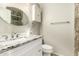 Well-lit bathroom featuring granite countertops, stylish vanity, and modern fixtures at 4040 E Rowel Rd, Phoenix, AZ 85050