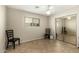 Neutral bedroom with tile floors, a window, and a closet with sliding mirrored doors at 4040 E Rowel Rd, Phoenix, AZ 85050