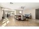 Spacious living room featuring tile floors, neutral walls, and a ceiling fan at 4040 E Rowel Rd, Phoenix, AZ 85050