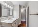 Bathroom with large mirror, modern vanity with drawers, and ample lighting at 4622 N 78Th St, Scottsdale, AZ 85251