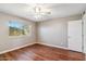 Cozy bedroom with a ceiling fan and large window at 4622 N 78Th St, Scottsdale, AZ 85251