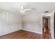 Bedroom includes hardwood floors, a ceiling fan, and a large closet at 4622 N 78Th St, Scottsdale, AZ 85251