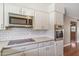 Modern kitchen features stainless appliances, white cabinetry and subway tile backsplash at 4622 N 78Th St, Scottsdale, AZ 85251