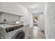 Well-lit laundry room equipped with modern washer and dryer units for convenient laundry tasks at 4622 N 78Th St, Scottsdale, AZ 85251