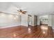 Spacious living room with hardwood floors, decorative light fixture, ceiling fan and view of the kitchen at 4622 N 78Th St, Scottsdale, AZ 85251