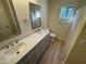 Bright bathroom featuring a dual sink vanity with decorative framed mirror and updated fixtures at 4757 E Amber Sun Dr, Cave Creek, AZ 85331