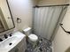 Updated bathroom featuring patterned tile flooring, a vanity with sink, and a shower with a curtain at 4757 E Amber Sun Dr, Cave Creek, AZ 85331