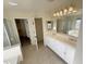 Bathroom featuring an undermount sink, tile flooring, a large mirror, and a shower/tub combo at 4757 E Amber Sun Dr, Cave Creek, AZ 85331