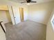 Neutral carpeted bedroom features a lighted ceiling fan and a closet at 4757 E Amber Sun Dr, Cave Creek, AZ 85331