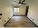 Bedroom featuring a ceiling fan, neutral paint, wood-look tile flooring and ample natural light at 4757 E Amber Sun Dr, Cave Creek, AZ 85331