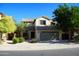 Charming two-story home with a neutral stucco facade, a tile roof, and a well-manicured front yard at 4757 E Amber Sun Dr, Cave Creek, AZ 85331