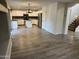 Spacious open-concept kitchen with white cabinets, granite countertops, stainless steel appliances, and wood-look tile flooring at 4757 E Amber Sun Dr, Cave Creek, AZ 85331