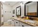 Bathroom with dual sinks, tile floors, and shower-tub combination at 5401 E Corrine Dr, Scottsdale, AZ 85254