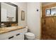 Bathroom showcasing granite countertop, white cabinets, and a walk-in shower with tile surround at 5401 E Corrine Dr, Scottsdale, AZ 85254