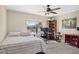 Bedroom with work area, shelving and natural light from window with outdoor view at 5401 E Corrine Dr, Scottsdale, AZ 85254