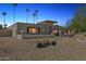 Attractive single-story home with desert landscaping, decorative rock and charming architectural details at 5401 E Corrine Dr, Scottsdale, AZ 85254