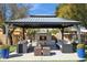 Outdoor living space with a gazebo, fireplace, and comfortable seating area at 5401 E Corrine Dr, Scottsdale, AZ 85254