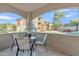 Cozy balcony with table and chairs with great view of the residential complex and palm trees at 5401 E Van Buren St # 1068, Phoenix, AZ 85008