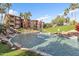 Scenic view of a waterway, fountain, and landscaping surrounded by luxurious apartment buildings at 5401 E Van Buren St # 1068, Phoenix, AZ 85008