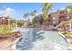 Relaxing water feature and fountains surrounded by well maintained landscaping and apartment buildings at 5401 E Van Buren St # 1068, Phoenix, AZ 85008