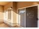 Outdoor patio featuring white door, window with shutters and sliding glass door at 5401 E Van Buren St # 2050, Phoenix, AZ 85008