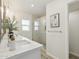 Bathroom with a glass-enclosed shower, dual sinks, and modern fixtures at 5412 E Tierra Buena Ln, Scottsdale, AZ 85254