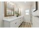 Bright bathroom featuring double sinks, quartz countertops and a glass shower at 5412 E Tierra Buena Ln, Scottsdale, AZ 85254