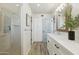 Light and airy bathroom with modern vanity, glass shower enclosure, and wood-look floors at 5412 E Tierra Buena Ln, Scottsdale, AZ 85254