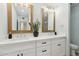 Bathroom featuring a double sink vanity with quartz countertops, wood-look floors, and modern lighting at 5412 E Tierra Buena Ln, Scottsdale, AZ 85254