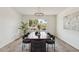 Bright dining room featuring a modern chandelier and an outdoor view at 5412 E Tierra Buena Ln, Scottsdale, AZ 85254