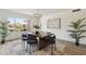 Elegant dining room with a decorative rug and a view of the backyard at 5412 E Tierra Buena Ln, Scottsdale, AZ 85254