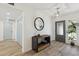 Welcoming entryway with wood-look floors, stylish console table, and modern light fixture at 5412 E Tierra Buena Ln, Scottsdale, AZ 85254