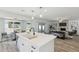 Open-concept kitchen features an eat-in island and seamlessly flows into the living room at 5412 E Tierra Buena Ln, Scottsdale, AZ 85254