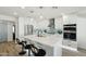 A modern eat-in kitchen with quartz counters, white cabinets, stainless appliances and wood-look floors at 5412 E Tierra Buena Ln, Scottsdale, AZ 85254